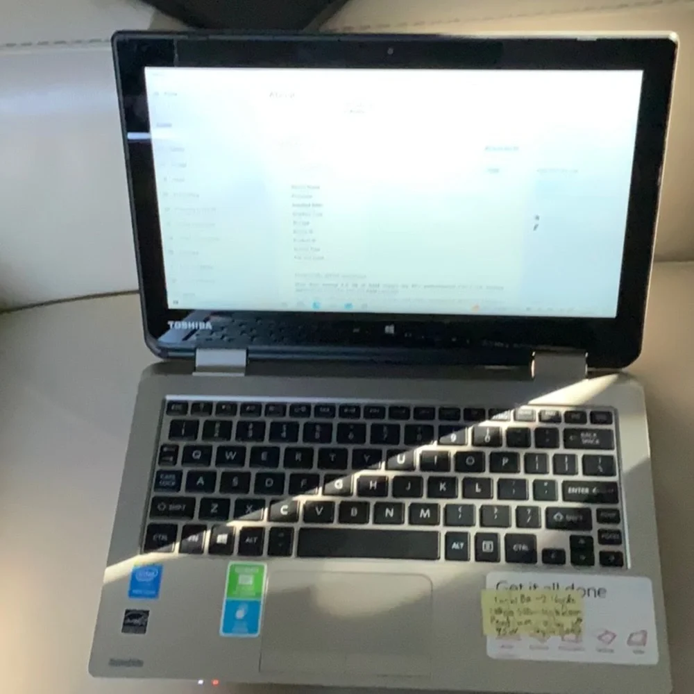 Toshiba Satellite Radius 11 L15W-B1208 with aftermarket charger. Touch screen.
